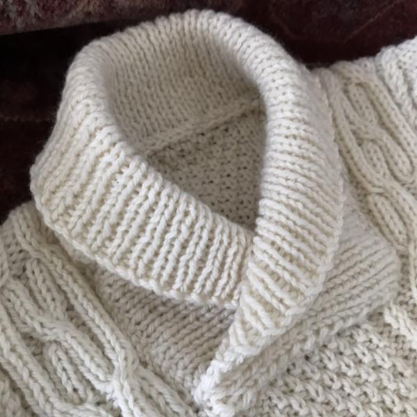 Neck detail of baby Aran sweater nz made