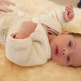 Newborn in natural premature cardigan