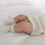 Newborn wearing baby vest & socks set