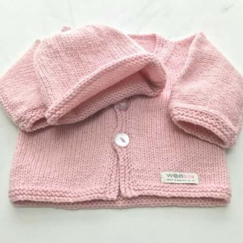 Pink baby cardigan and beanie