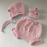 Pink chunky hat, over nappy pants and loafers