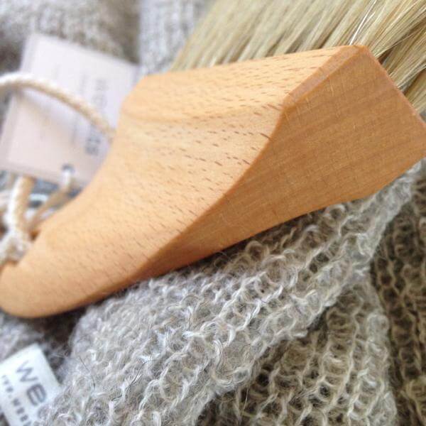 shaped wooden handle of beach brush