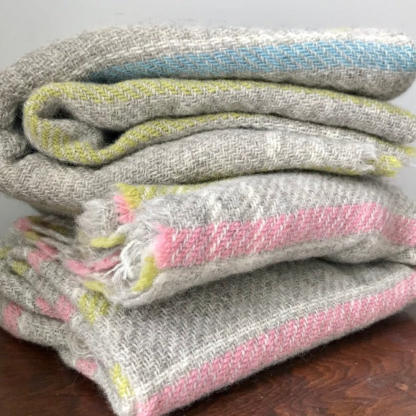 Stack of Short Fringe Baby Carnival Throws