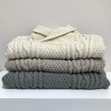 Stack of the baby Aran jumper