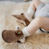 Toddler wearing sheepskin booties