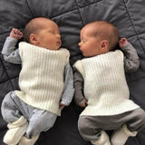 Twins wearing premature baby vests